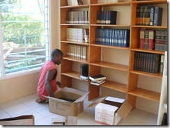 Alick unpacking the books
