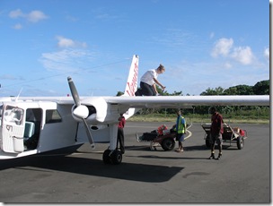 Miss Pilot checks the fuel tank for the engine on the right.