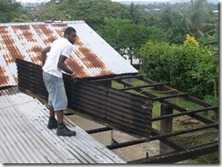 Job pulling off the iron roofing