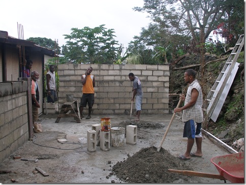 Pastor Robert (on left) inspecting the work