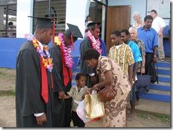 JBI Principal's wife, Roz giving gifts