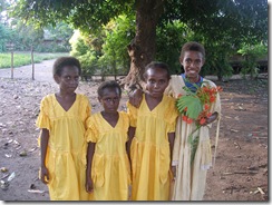Trinity AG girls in matching yellow dresses