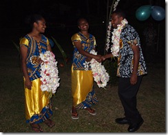 Nicole & Vaily greeting grads with  leis