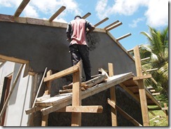 Avia plastering the back wall